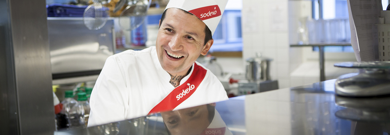 Sodexo chefs preparing food behind a counter